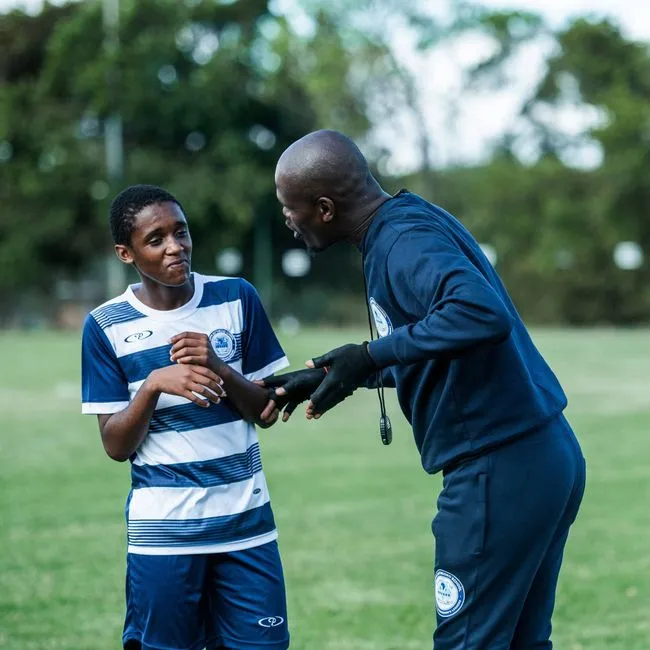 Personal trainer coaching a client